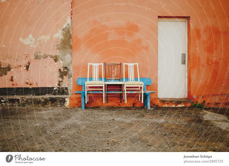 Three chairs on a bench, Puerto de la Cruz, Tenerife Facade Blue Orange White Colour Bench Chair Row of seats Row of chairs 3 Wall (building) Spain Canaries