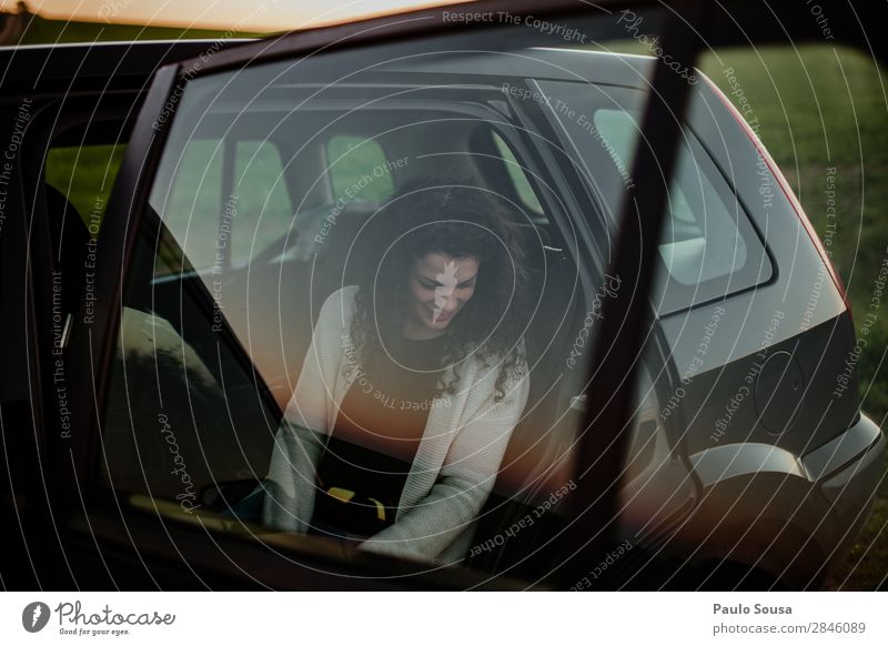 Woman smiling on a car Lifestyle Vacation & Travel Tourism Trip Human being Adults 1 18 - 30 years Youth (Young adults) Transport Vehicle Car Observe Movement