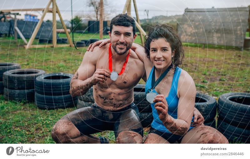 Couple showing their medals after race Happy Playing Feasts & Celebrations Sports Award ceremony Success Human being Woman Adults Man Hand Smiling Authentic