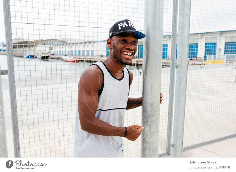 Black man posing on sports ground Man Sports ground Posture Town Self-confident African-American Leisure and hobbies Adults Strong sportsman Contentment