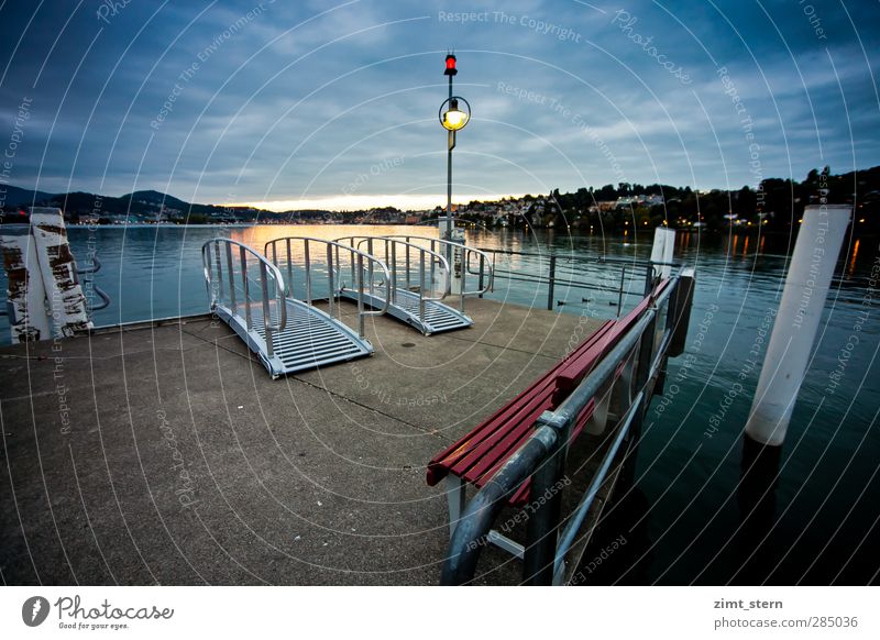 The red bench Vacation & Travel Trip City trip Lakeside Lucerne Switzerland Lake Lucerne Sky Clouds Town Ferry terminal Lantern Bench Blue Red Silver White