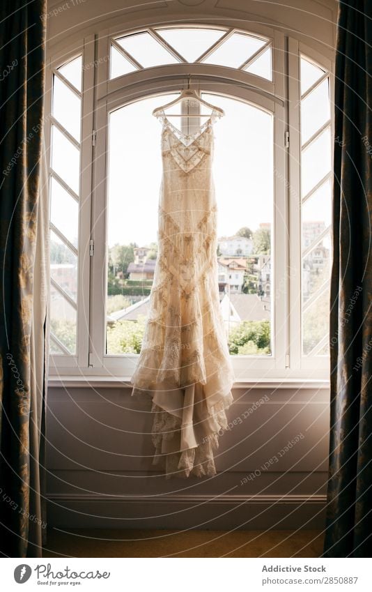 Wedding dress hanging on window Dress Hanger Elegant bridal Ornamental Beauty Photography Clothing Light Smock Fashion embroidered Style Feasts & Celebrations