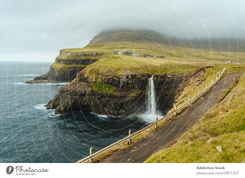 Rocky coast with pathway running on top Landscape Coast Fog Cliff Ocean scenery seascape Tourism Vacation & Travel Tourist Vantage point Mountain Nature Freedom