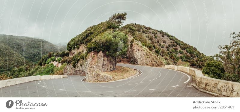 Curved road in mountains Street twist Mountain scenery Landscape Nature Cloud cover Highway Tourism Vacation & Travel Lanes & trails Gloomy Rural Dangerous