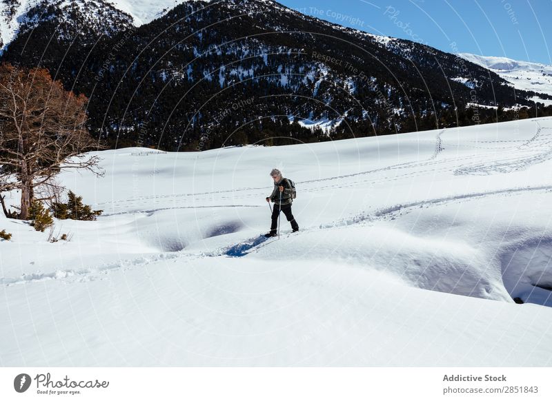 Man walking through the snow Snow Hiking Walking trekking White Winter Snow shoes Nature Lifestyle Mountain Action Cold Sky Climbing 2 Backpack snowshoe