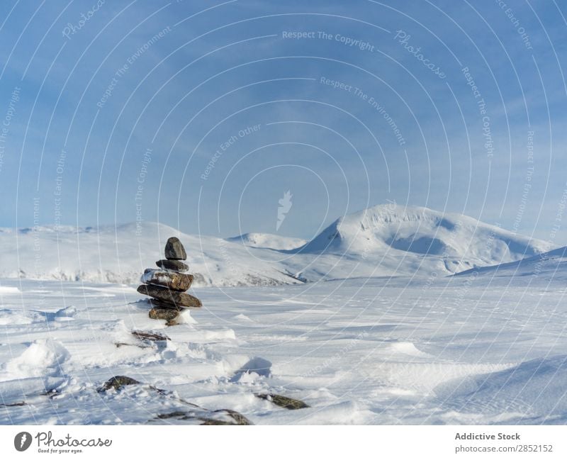 Stacked stones in winter Stone Tower Hill Snow Nature Zen Relaxation Landscape Winter Cold Ice Blue Frost White Beautiful Fresh Weather Mountain Calm Day