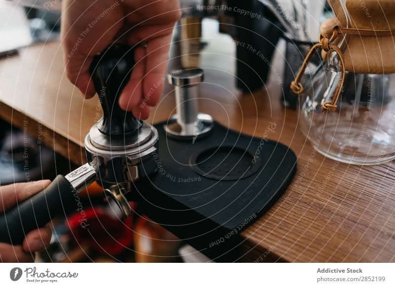 Hand of person making a fresh coffee Coffee Ground Make barista bartender Drinking Café Beverage Caffeine Shopping Espresso machine preparing maker Restaurant