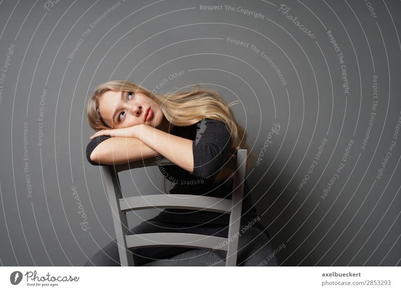 bored young woman stares at the ceiling Lifestyle Human being Feminine Young woman Youth (Young adults) Woman Adults 1 13 - 18 years 18 - 30 years Jeans Sweater