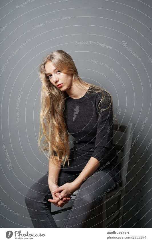 casual young blonde sitting on chair Chair Human being Feminine Young woman Youth (Young adults) Woman Adults 1 13 - 18 years 18 - 30 years Jeans Blonde