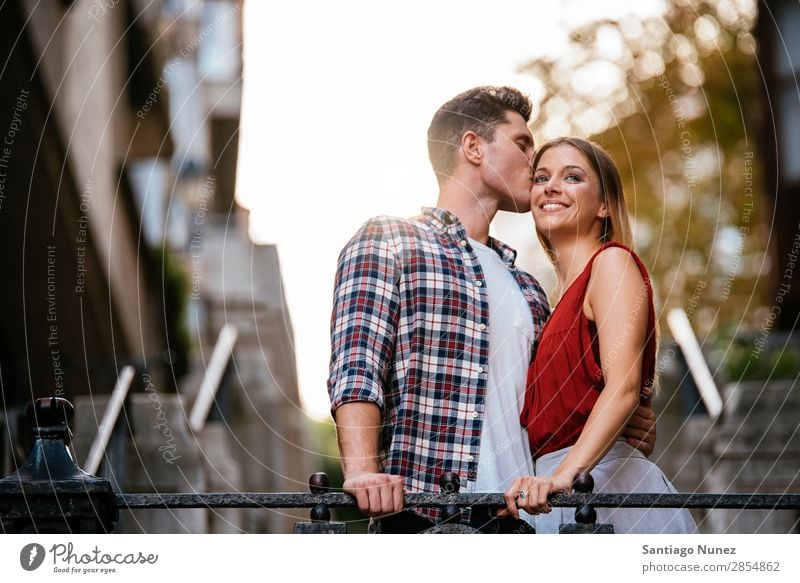 Young loving couple kissing in the street. Couple Love Woman Relationship Kissing romantic Smiling Youth (Young adults) Beautiful Embrace Romance Happiness