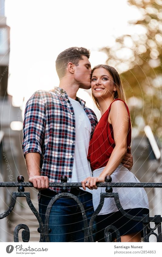 Young loving couple kissing in the street. Couple Love Woman Relationship Kissing romantic Smiling Youth (Young adults) Beautiful Embrace Romance Happiness