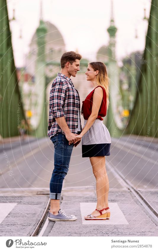 Young loving couple hugging in the street. Couple Love Woman Relationship Youth (Young adults) Beautiful Embrace Romance Happiness Kissing romantic Smiling