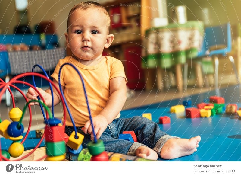 Happy baby playing with toy blocks. Baby Playing childcare Kindergarten School Toys Toddler Boy (child) Small Child LEGO Considerate Story Cute Joy Preschool