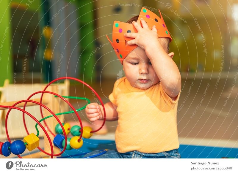 Happy baby playing with toy blocks. Baby Playing childcare Kindergarten School Toys Crown King Bite Toddler Boy (child) Small Child Considerate Story