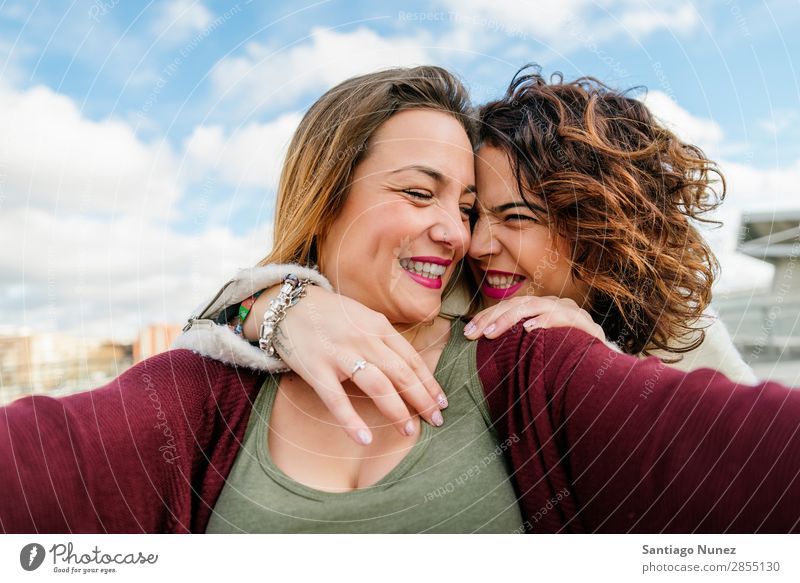 Two beautiful women taking selfie in the street. Selfie Laughter Happy Friendship girlfriends Youth (Young adults) Portrait photograph Summer Lifestyle Woman