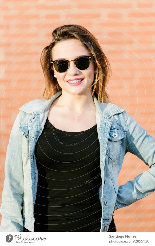 Blonde hipster posing with straw hat against orange brick background. Fashion Wall (building) Girl Hip & trendy Woman Youth (Young adults) Hipster Easygoing