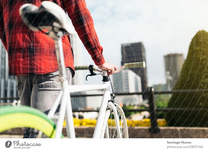 Young man on bike in the city Man Bicycle fixie Hipster Lifestyle Walking Cycling City Solar cell Town Human being handsome Style Street Portrait photograph