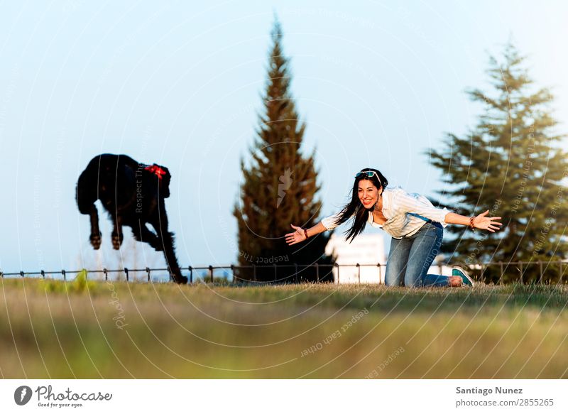 Beautiful young loving her dog. Girl Woman Dog Pet Puppy Love Running Kissing Embrace Town Youth (Young adults) Sports Animal Considerate Style Happy Smiling