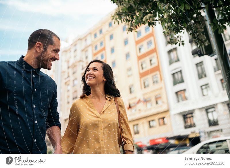 Smiling couple of lovers having fun. Couple Woman Date Love Hand Man Girl Youth (Young adults) Romance City Happiness Happy Human being Together Street romantic