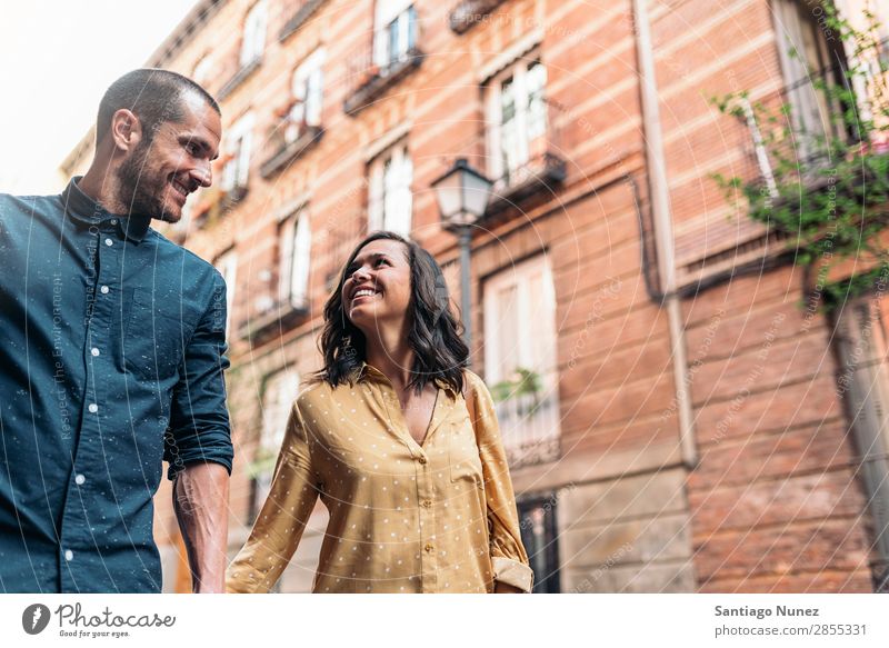 Smiling couple of lovers having fun. Couple Woman Date Love Hand Man Girl Youth (Young adults) Romance City Happiness Happy Human being Together Street romantic