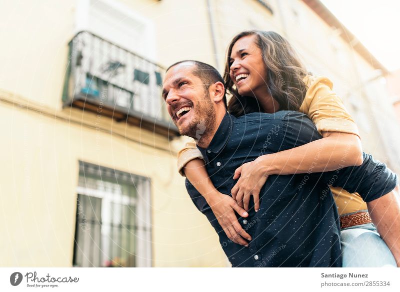 Smiling couple of lovers having fun. Couple Woman Date Love Embrace Man Girl Youth (Young adults) Romance City Happiness Happy Human being Together Street