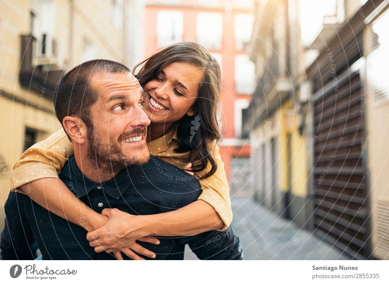 Smiling couple of lovers having fun. Couple Woman Date Love Embrace Man Girl Youth (Young adults) Romance City Happiness Happy Human being Together Street