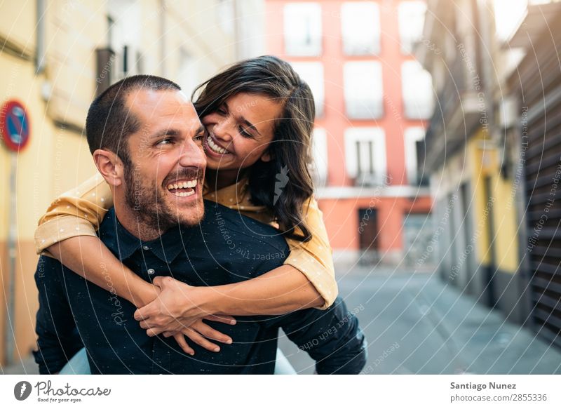 Smiling couple of lovers having fun. Couple Woman Date Love Embrace Man Girl Youth (Young adults) Romance City Happiness Happy Human being Together Street