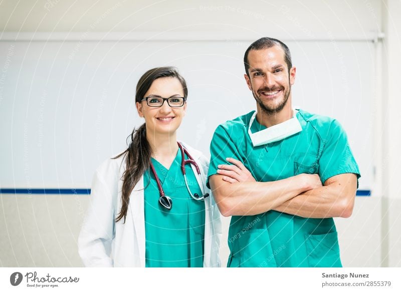 Smiling doctor and nurse portraiture clinic Self-confident coworker Doctor examining Woman Girl Hand Happy Healthy Health care Hospital Profession Laboratory