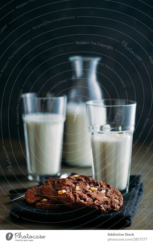 Chocolate cookies and glasses of milk on dark background Baking Bottle Breakfast brownie Cake Hot Chocolate Cookie cooling rack Dark Dessert Drinking Food Glass