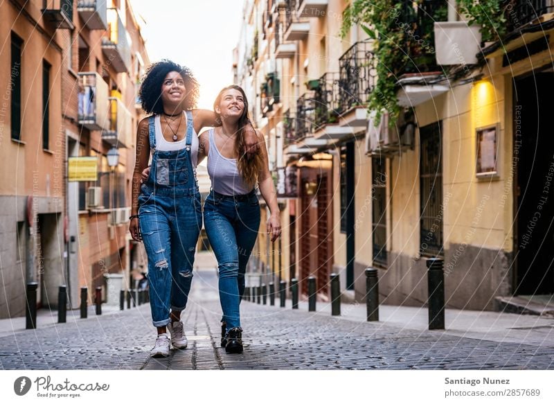 Beautiful women having fun in the street. Woman Friendship Youth (Young adults) Happy Summer Human being Joy Smiling Walking Girl pretty 2 Together Couple