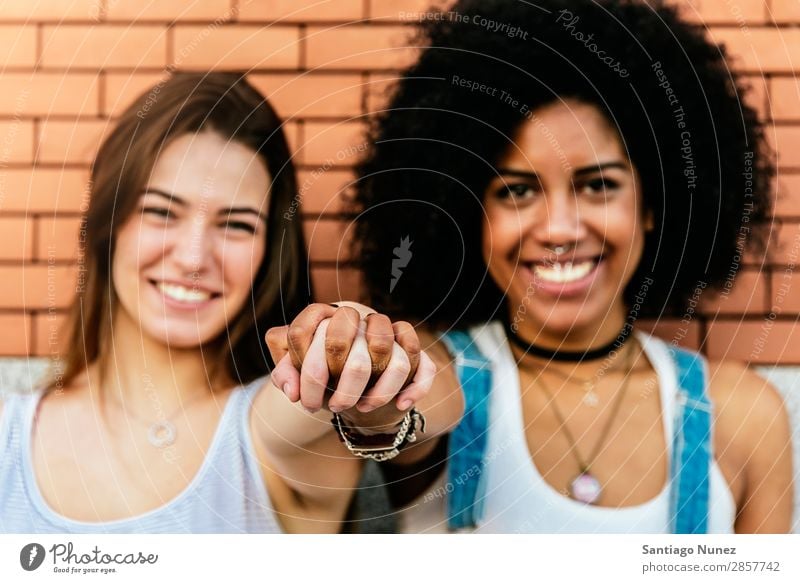 Beautiful women having fun in the street. Woman Friendship Youth (Young adults) Happy Summer Portrait photograph Relationship Human being Joy Smiling Hand