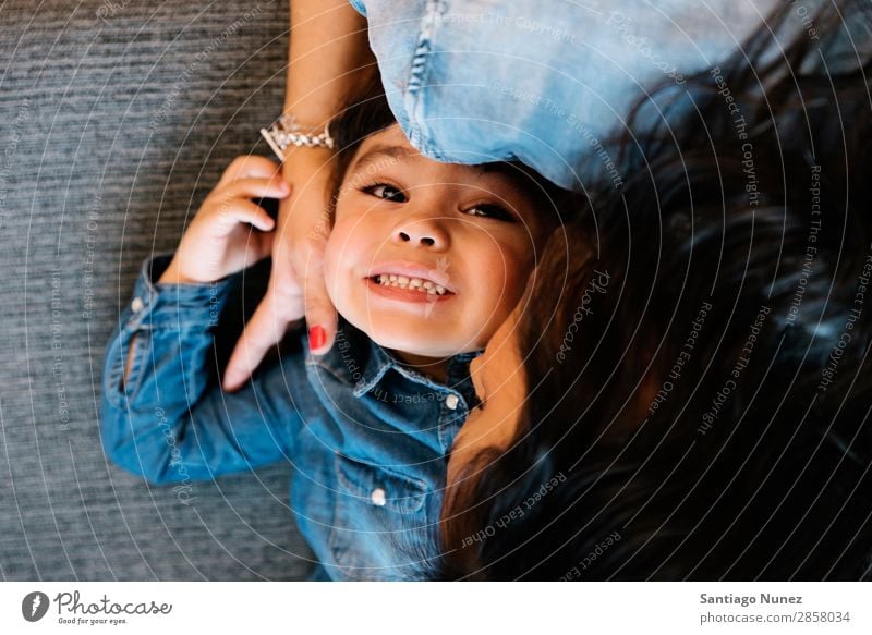 Happy mother with their daughter. Family & Relations Home Youth (Young adults) Child White Human being lifestyle mother Embrace Woman Parents Kissing