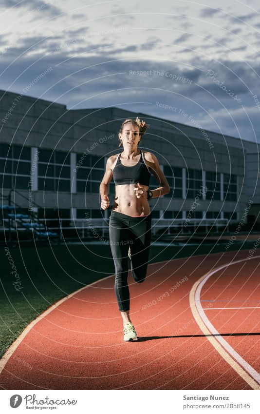 Attractive woman Track Athlete Running On Track Action athleticism cacucasian challenge Competition Self-confident Determination Practice Woman finishing