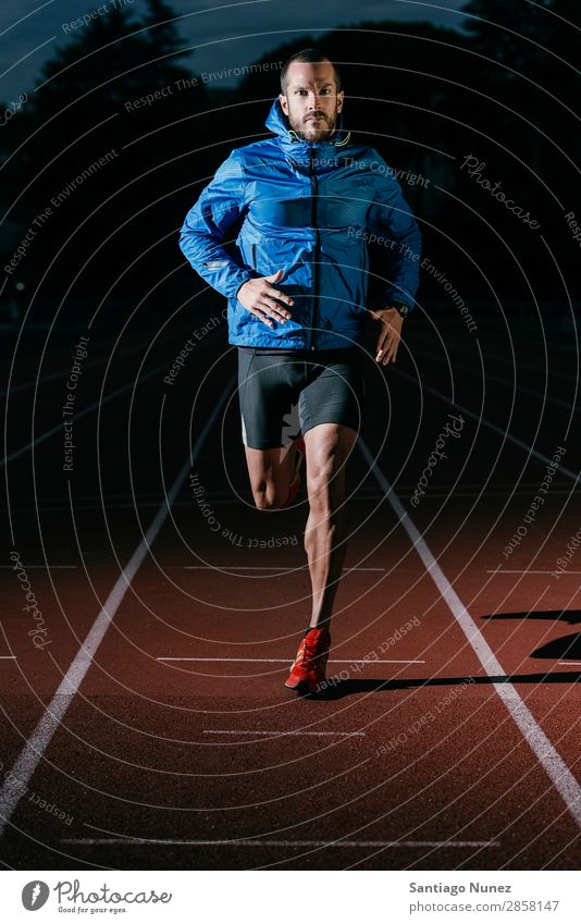 Attractive man Track Athlete Running On Track Action athleticism Beginning cacucasian challenge Competition Self-confident Determination Practice Athletic