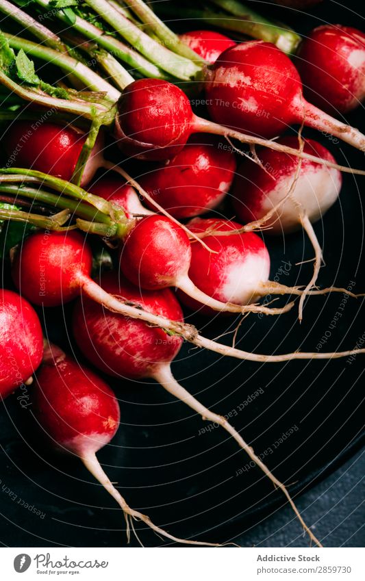 Radish on dark background Dark background Ecological Food Fresh Green Harvest Healthy Ingredients Leaf Organic Red Vegetable Vegetarian diet