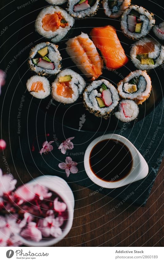 Sushi served on blackboard asian Avocado Chopstick Dish Fish Flower Food Ginger Japanese maki nigiri nori Raw Rice Salmon sashimi Seafood Smoked salmon