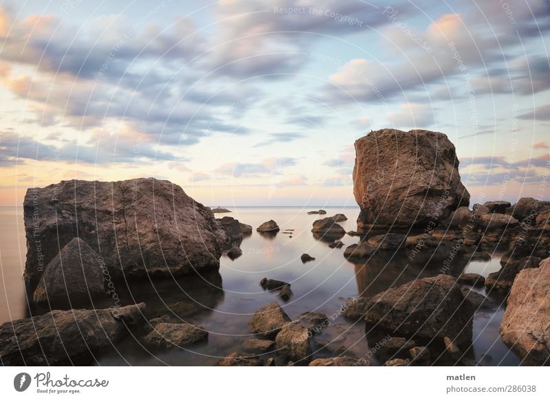 still air Nature Landscape Sky Clouds Horizon Sunrise Sunset Summer Weather Beautiful weather Rock Coast Ocean Gigantic Blue Brown Far-off places