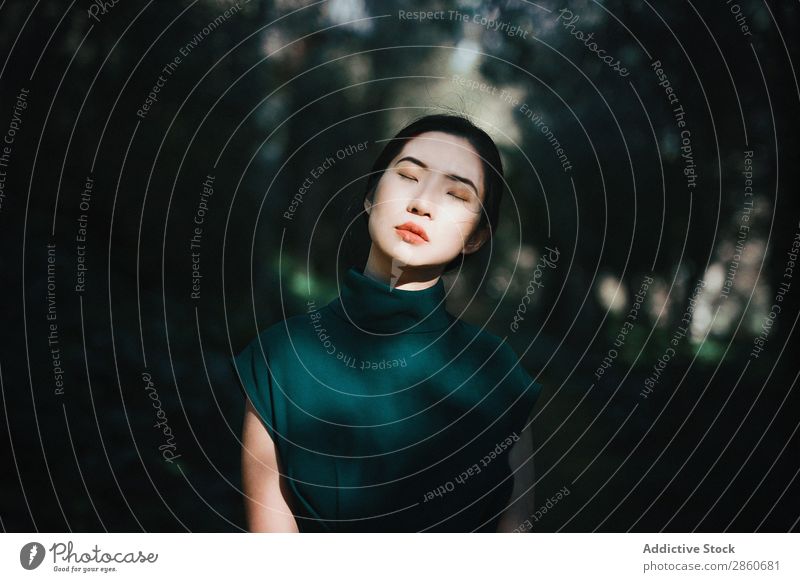 Asian woman with eyes closed in the forest Woman Youth (Young adults) Attractive Dress Green asian Japanese Park Relaxation Rest Calm Peaceful Beautiful