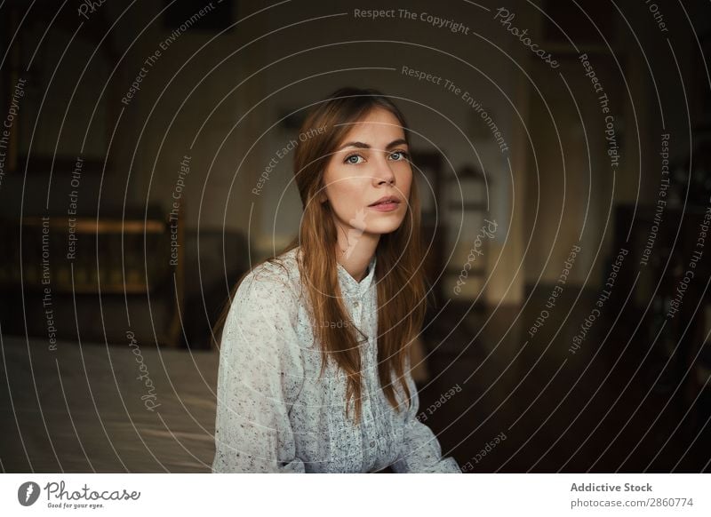 Young woman sitting ob bed in apartment Woman pretty Youth (Young adults) Sit Bed Flat (apartment) Looking into the camera Home House (Residential Structure)