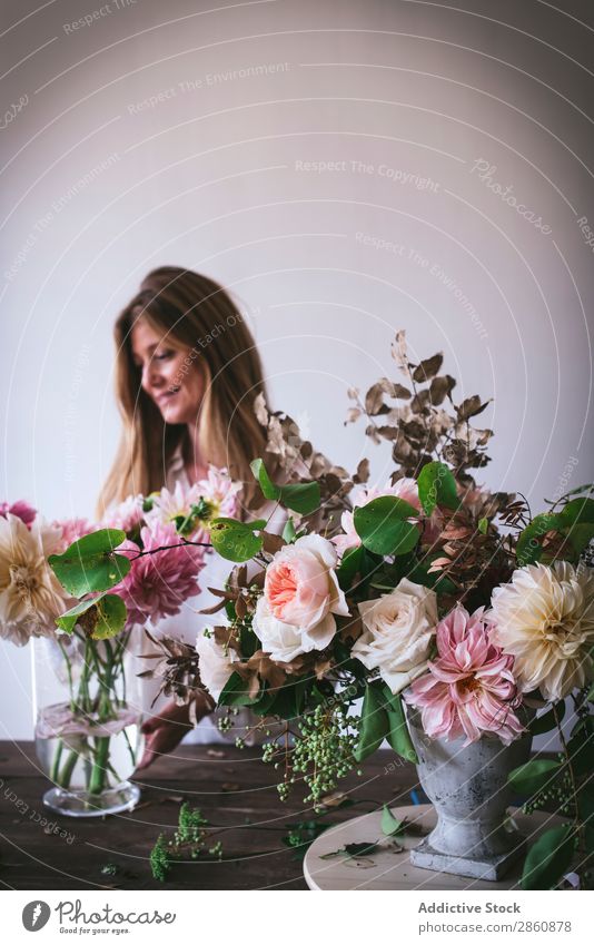 Woman near table with bouquets of blooms in vases Flower Bouquet Vase Table Plant Chrysanthemum Rose Twig Happy Fresh bunch Leaf Wood Lady Branch Bud Nature