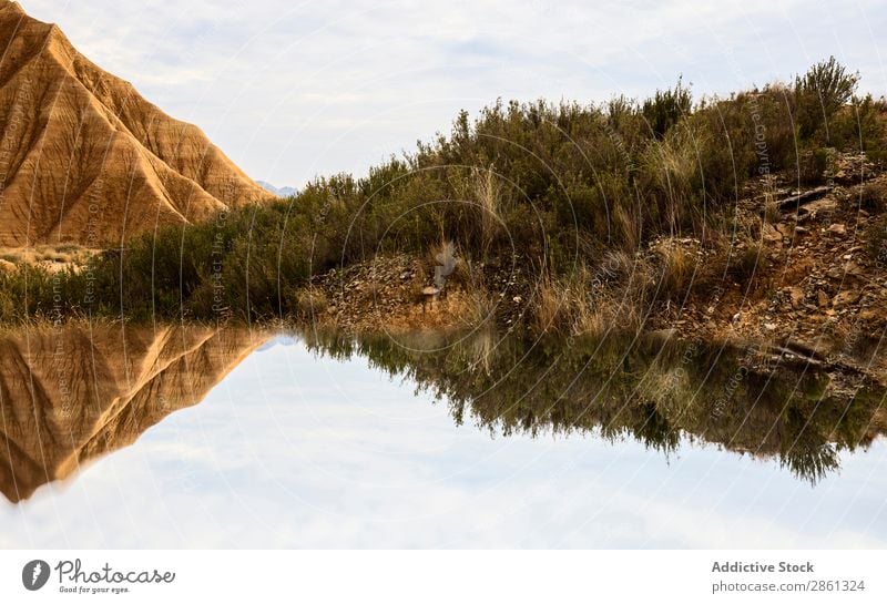 Water near stone desert hills Hill Mountain Surface Bardenas Reales Spain Navarra Desert Glade Canyon Stone Amazing Wonderful Valley Vantage point Coast