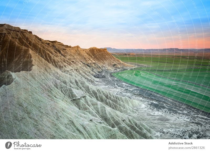 Stone desert hills near green field Hill Mountain Field Sky Bardenas Reales Spain Navarra Desert Blue Green Meadow Amazing Canyon Wonderful Valley Vantage point