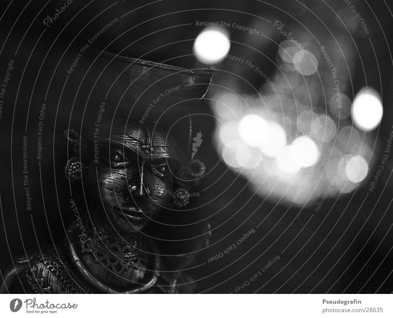 mask Mask Metal Esthetic Dark Chandelier Shop window Black & white photo Detail Deserted Artificial light Reflection Low-key Blur Looking