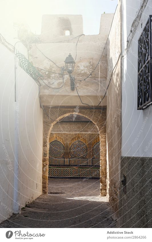 Way between buildings on street way Building Street Corridor tangier Morocco Beautiful weather Construction Stone Arch City Town Africa Sun Sunlight Summer