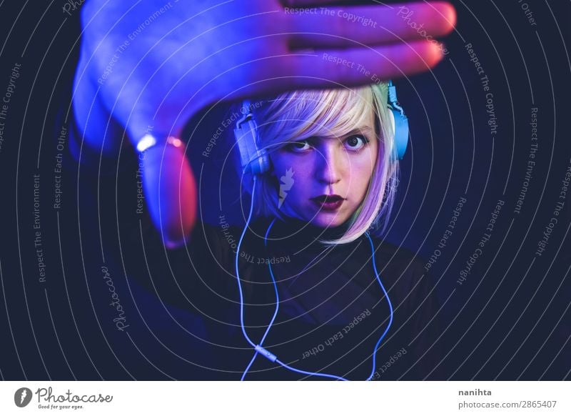 Young woman listening to music Lifestyle Beautiful Hair and hairstyles Face Night life Music Disc jockey Headset Technology Entertainment electronics