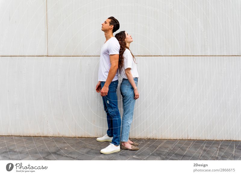 Portrait of unhappy frustrated couple standing back to back Lifestyle Joy Human being Young woman Youth (Young adults) Young man Woman Adults Man