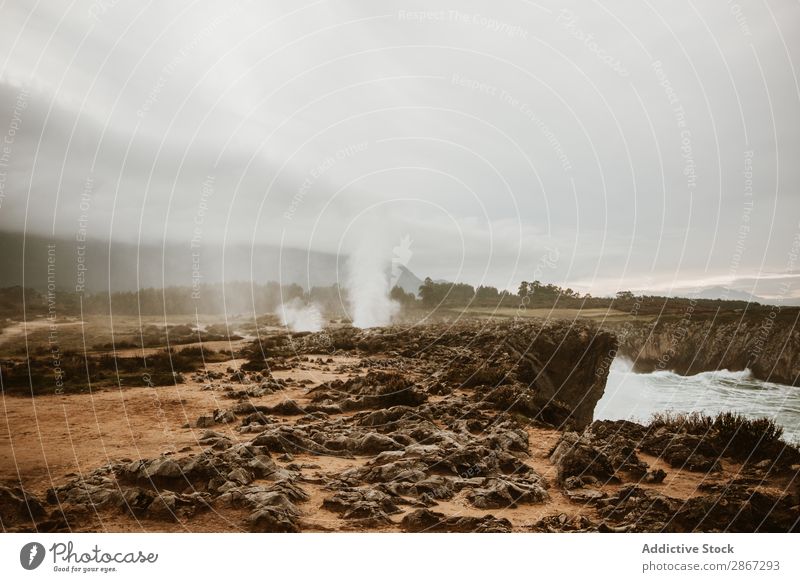 Crater between land and cloudy sky Volcanic crater Landing Sky Clouds Smoke bufones de Pria asturias Spain Nature Vacation & Travel Ground Heaven Small Fog