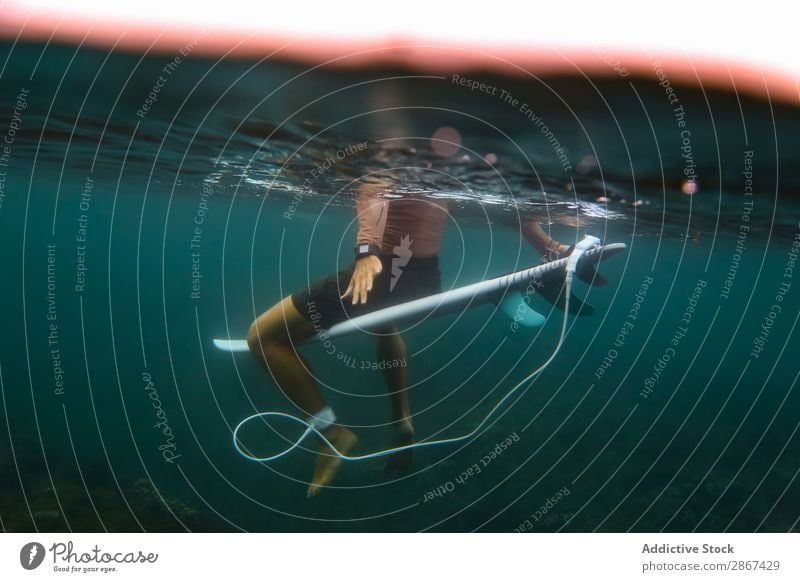 Man sitting on surf board floating in blue water Surfboard Water Sports Bali Indonesia Surfing Blue Wave Floating Ocean Surface Sit azure Ripple Landscape