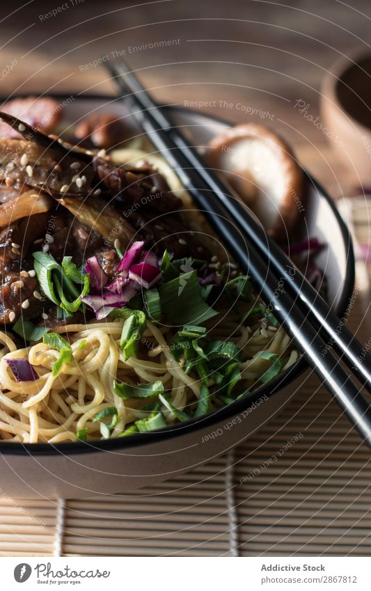 Miso noodles with egg plants and shiitake in bowl on table miso Aubergine Bowl Pasta chinese mushroom table mat Chopstick Scissors bunch onion Ginger