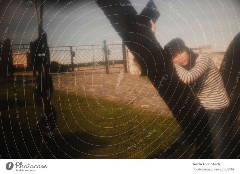 Woman with book sitting on monument near building on shore Book Monument Building Coast Sky Reading Volume Ocean Abstract Construction Elegant Cap